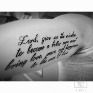 "Long tail quote tattoo for men inner bicep"